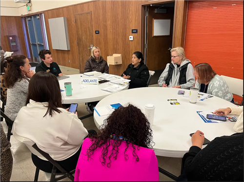 DAC members at a table talking